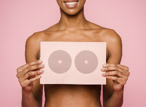 What are the first signs of breast cancer?